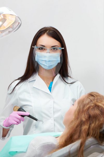 professional-female-dentist-at-work-9SDJLQ4-e1616852692593.jpg